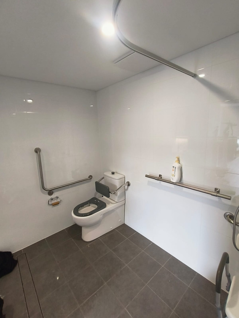 Grab rails installed in a Morley bathroom to reduce fall risk at home